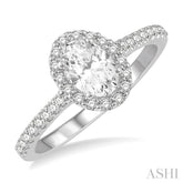 1 1/10 ctw Oval Halo Round Cut Diamond Engagement Ring With 3/4 ct Oval Cut Center Stone in 14K White Gold